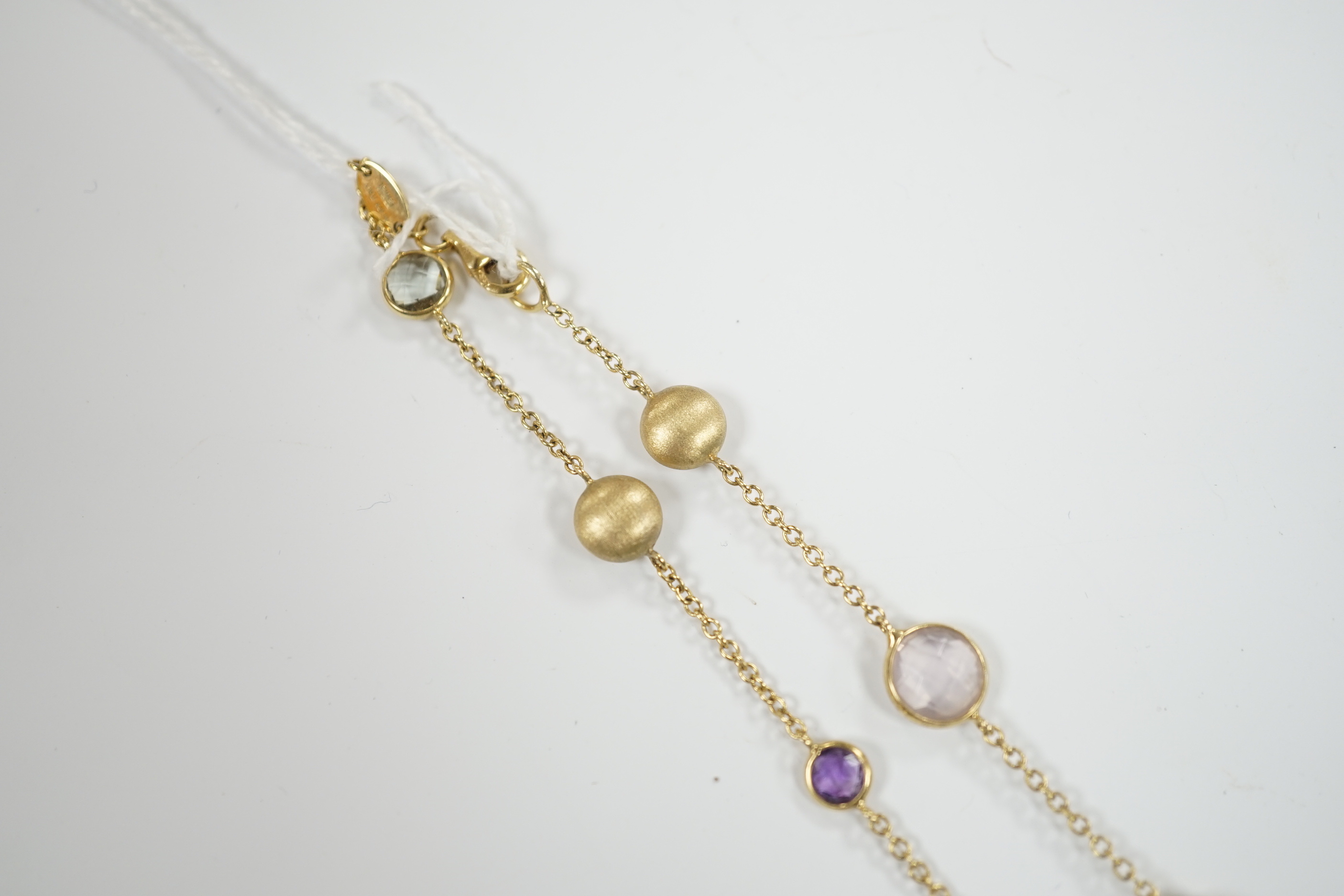 A modern Italian 9ct gold pebble and graduated multi gem set necklace, 68cm, gross weight 16 grams.